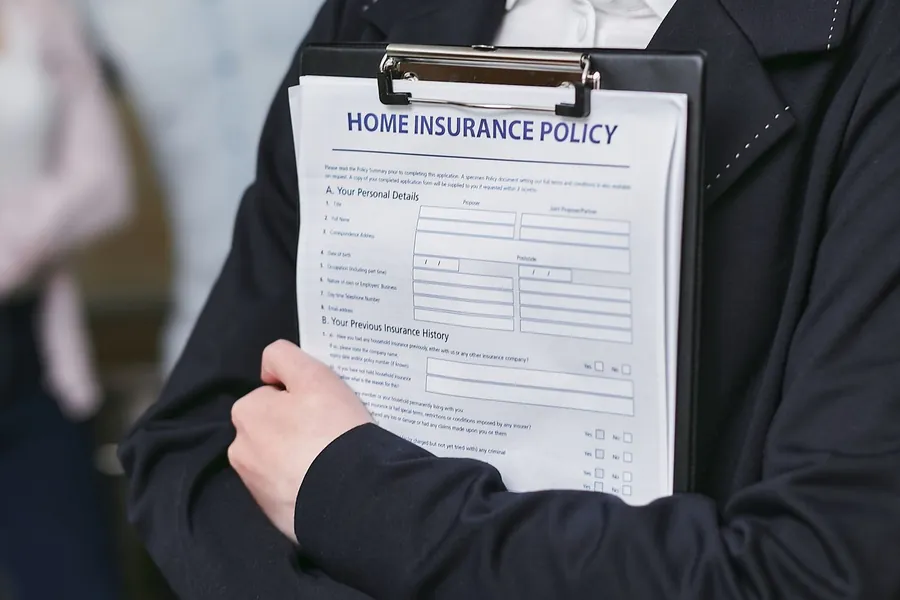 A buildings insurance policy being checked before a flat roof claim in Weston-super-Mare