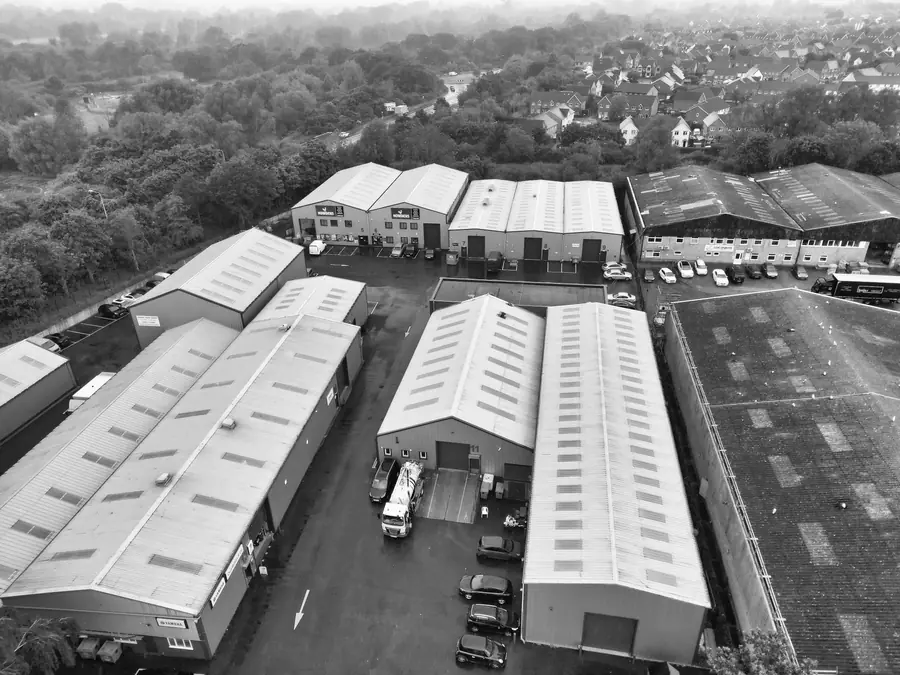 Aerial view of a small business park with industrial units, loading bays and a flat-roofed block between them, comparable to the estates off Kenn Road in Clevedon