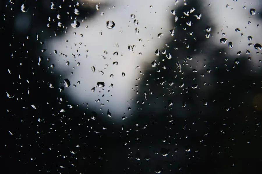 Rain running down a window pane - the weather that gave flat roofs their reputation in towns like Weston-super-Mare