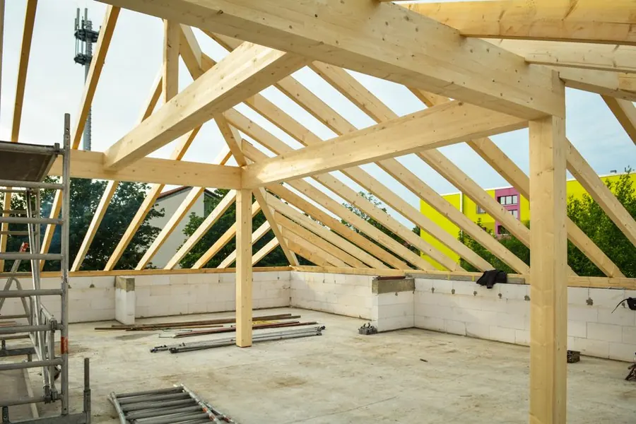 Timber roof structure showing the joists and deck that a flat roof build-up sits on, near Weston-super-Mare