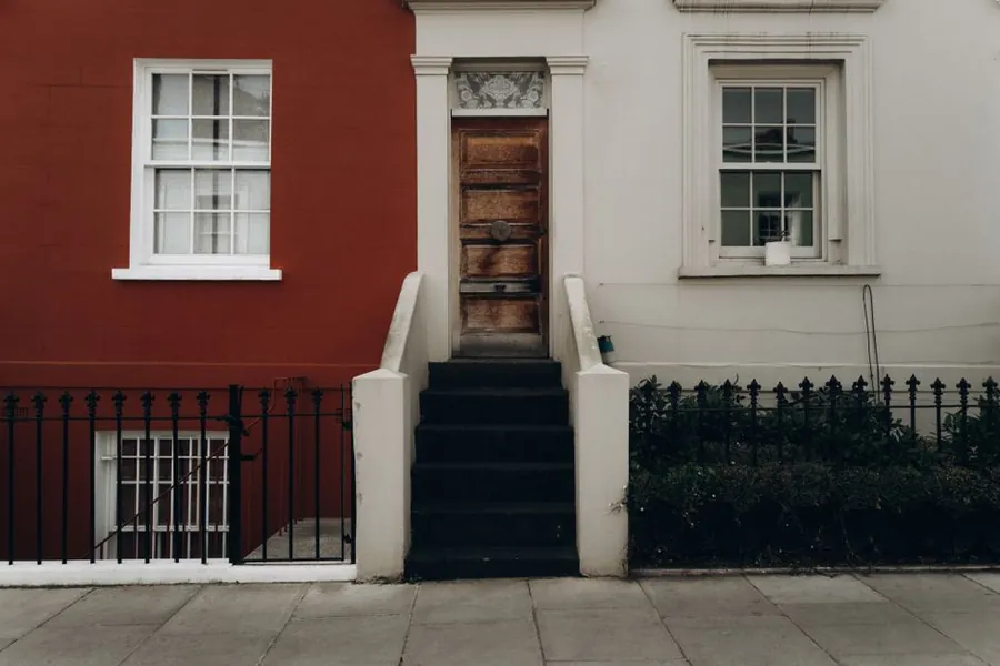 Steps up to a British front door, the kind of threshold height that a raised flat roof build-up has to work around in Weston-super-Mare