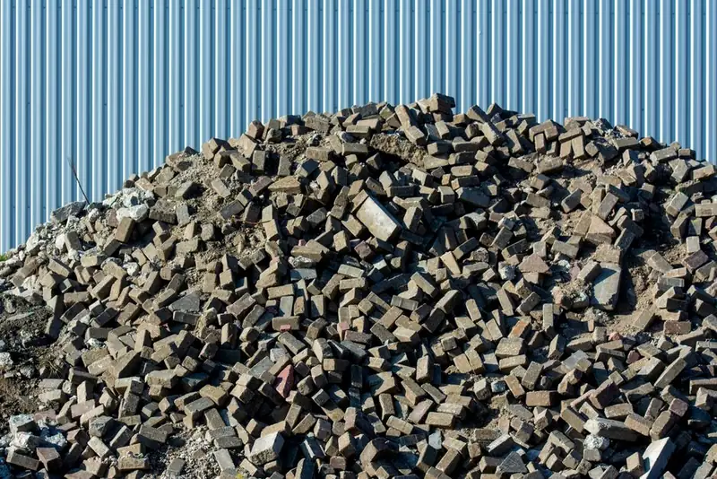 Stripped roofing waste piled ready for disposal after a flat roof replacement near Weston-super-Mare