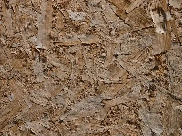 OSB board of the kind used to re-deck a garage flat roof before the new covering goes down