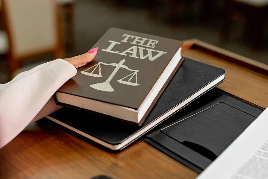 Legal reference books used to check leasehold service charge rules on flat roof works