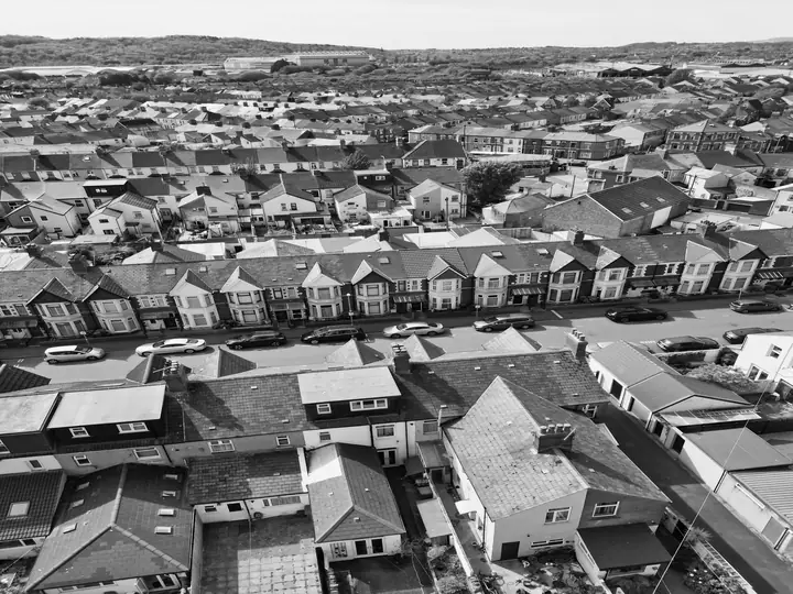 Aerial view of the backs of bay-fronted terraces with flat-roofed rear additions, dormers and outriggers, similar to the rear extensions found behind Clevedon houses