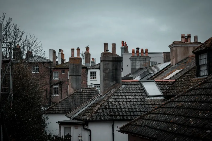 The mixed roofscape of an English seaside town - pitched slopes, chimneys and flat-topped additions side by side