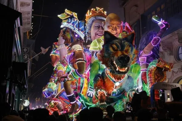 An illuminated carnival float glowing at night, the spectacle Bridgwater's November carnival is famous for