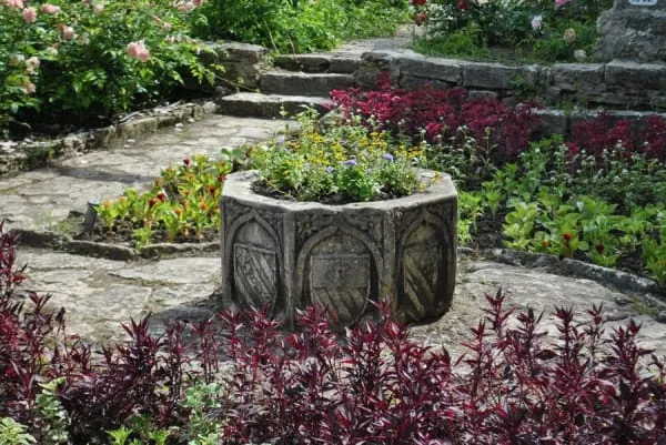 A peaceful walled garden with flowing spring water, the setting of Chalice Well below Glastonbury Tor