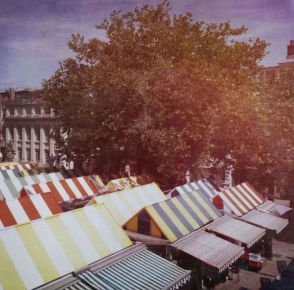 Busy street market stalls of the kind that fill Frome's centre for the monthly Independent