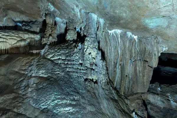 Illuminated stalactite formations inside a limestone showcave, the underground world of Gough's Cave at Cheddar