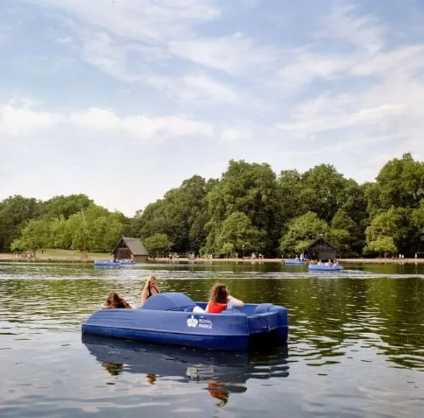 A seaside boating lake with parkland and headland beyond, the classic view across Portishead's Lake Grounds