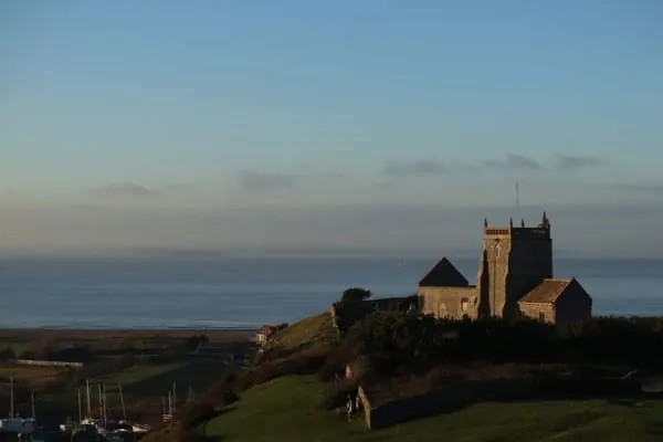 An ancient stone church on a grassy hilltop, the kind of landmark St Nicholas' old church makes above Uphill