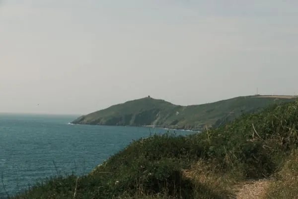 A footpath rounding a coastal headland, the kind of clifftop walking Poets' Walk gives Clevedon