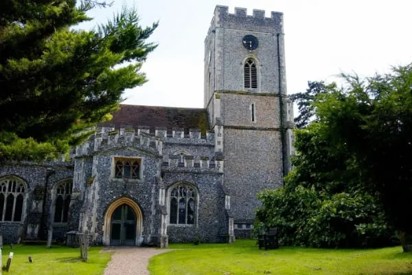 A medieval English parish church with a stone tower, the kind of building at the heart of Hutton village