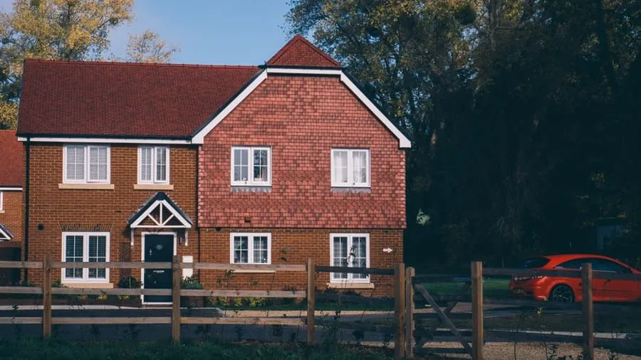 A brick house with an attached garage of the kind commonly re-roofed around Weston-super-Mare