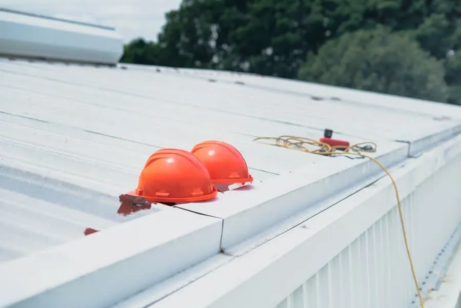 Edge protection and safety equipment set up for commercial flat roofing work
