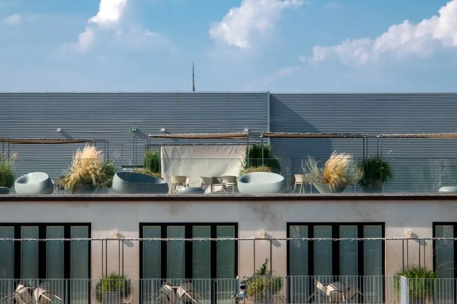 A finished roof terrace with furniture above a flat roof in Weston-super-Mare