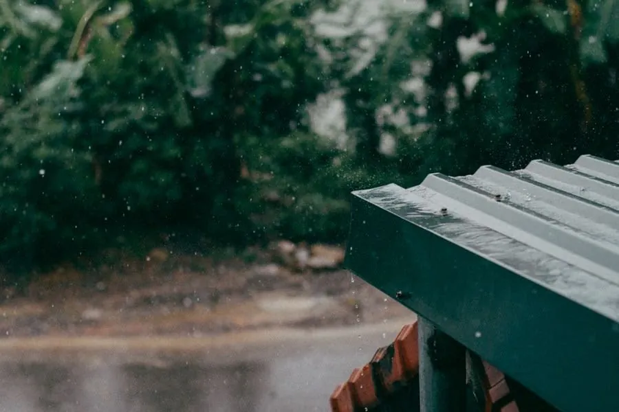 Rain running across a low-pitched flat roof surface near Weston-super-Mare
