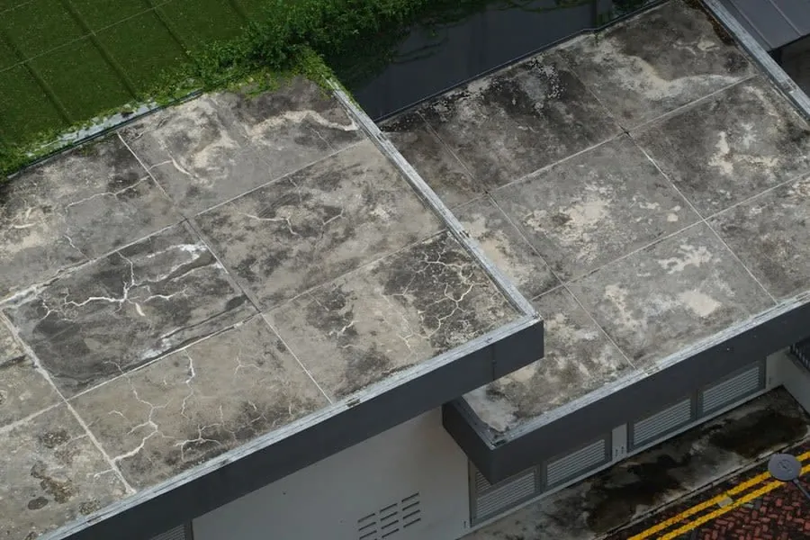 Upstands rising above a flat roof surface, the detail a rooflight kerb relies on, near Weston-super-Mare