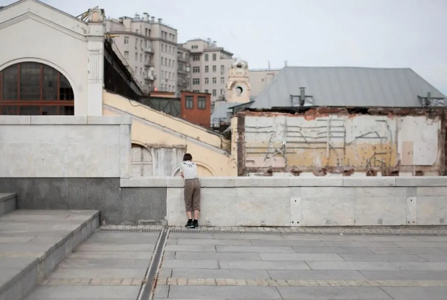 A person standing on a flat roof surface, illustrating occasional access in Weston-super-Mare