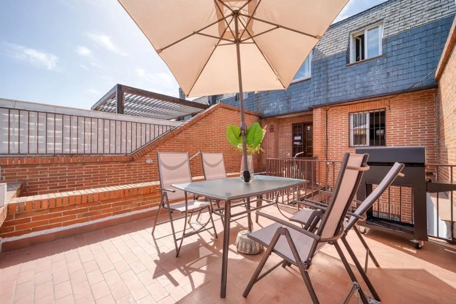 A roof terrace in use above a flat-roofed building, the kind homeowners in Weston-super-Mare ask about