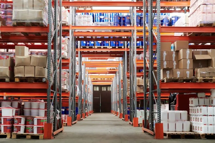 Racking and stock inside a commercial unit protected by the flat roof above it