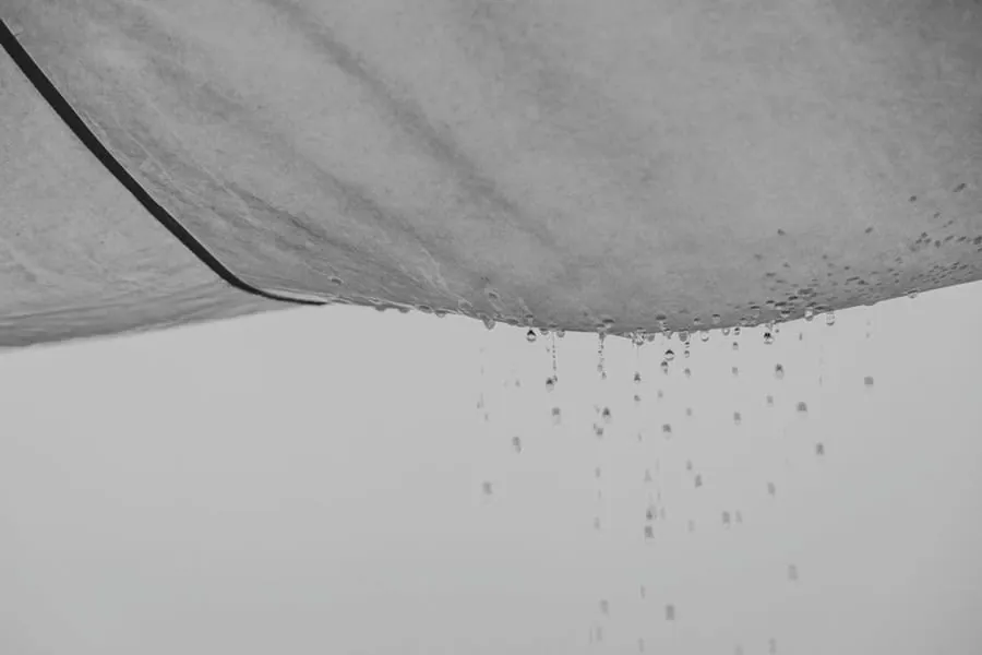 Water dripping from a ceiling beneath a failing flat roof in Weston-super-Mare